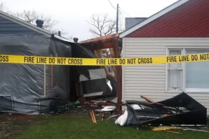 The damage caused by a truck that crashed into a Detroit Lakes motel, severely injuring one occupant and paralyzing another, is seen behind the caution tape. 