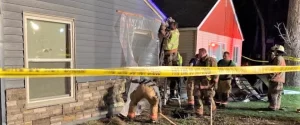 Emergency responders doing quick repairs to the damage caused to a Detroit Lakes motel after a driver crashed into the motel, severely injuring two occupants.